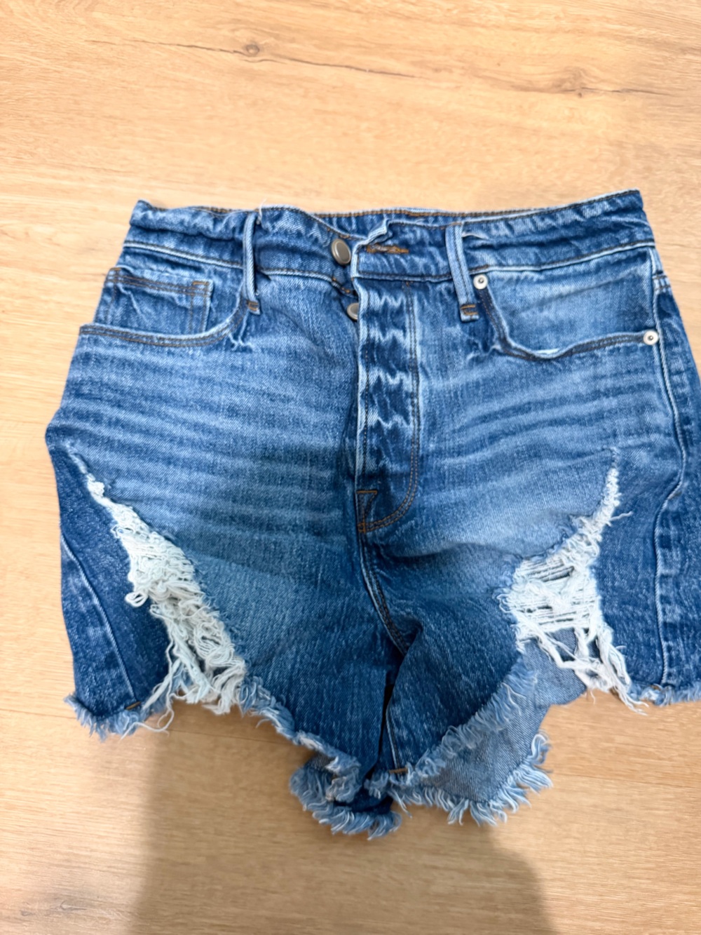 Good American Distressed High-Rise Denim Shorts in Medium Blue